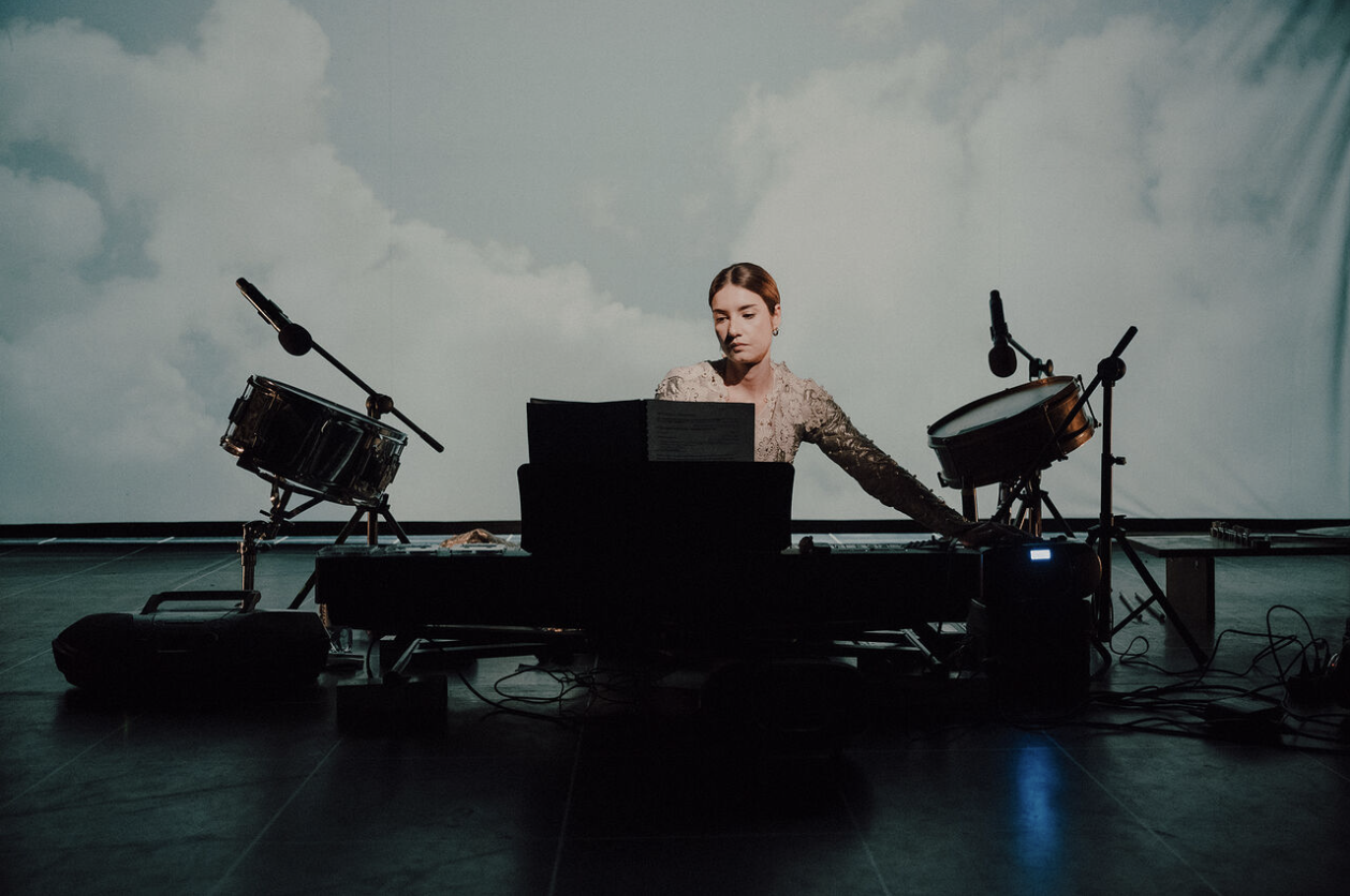 She stands in the middle of the battlefield